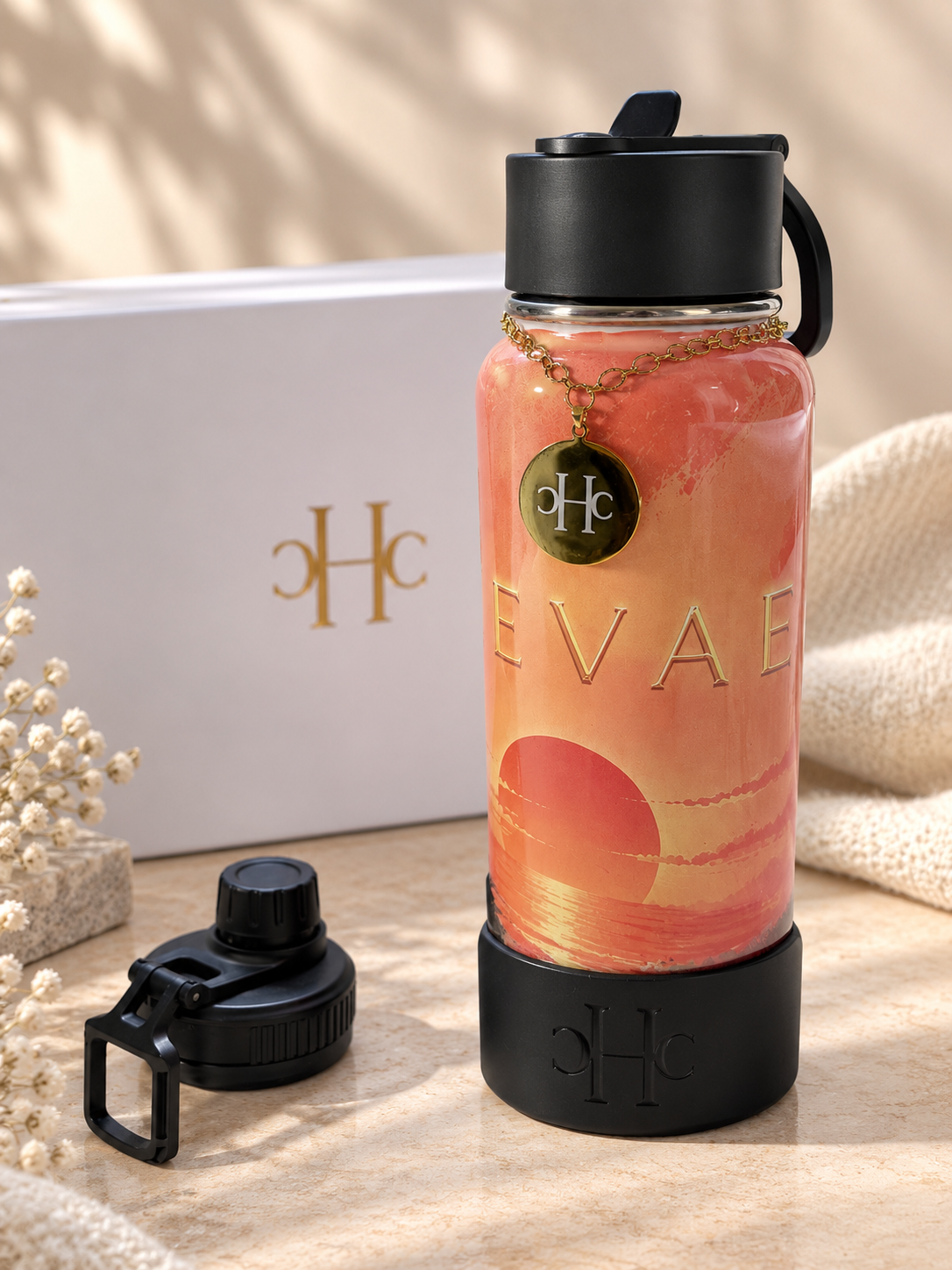 Gourde HEVAE Sunset avec son coffret blanc et son bouchon sport